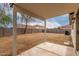 The covered patio overlooks a spacious backyard and block fence at 10625 E Bramble Ave, Mesa, AZ 85208