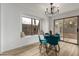 Cozy dining area with window seat, backyard view and modern light fixture at 10625 E Bramble Ave, Mesa, AZ 85208