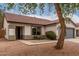 Attractive single-story home with a tile roof, desert landscaping and green accents on a well-manicured lot at 10625 E Bramble Ave, Mesa, AZ 85208