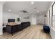 Bright living room with hard surface floors, neutral walls and modern furnishings at 10625 E Bramble Ave, Mesa, AZ 85208