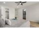 Spacious main bedroom with ceiling fan and ensuite access at 10625 E Bramble Ave, Mesa, AZ 85208