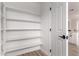 Walk-in pantry with plenty of shelving for storage at 10625 E Bramble Ave, Mesa, AZ 85208