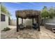 Backyard featuring a palapa, spa, and stone flooring at 11430 N 109Th St, Scottsdale, AZ 85259