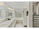 Bright bathroom featuring a large vanity, soaking tub, and custom storage, perfect for relaxation and organization at 11430 N 109Th St, Scottsdale, AZ 85259