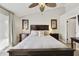 Serene bedroom featuring stylish decor, ceiling fan and ample natural light at 11430 N 109Th St, Scottsdale, AZ 85259