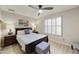 Cozy bedroom with a queen bed, dark furniture, and plantation shutters at 11430 N 109Th St, Scottsdale, AZ 85259