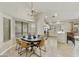 Open concept kitchen and dining area with bar seating and stainless appliances at 11430 N 109Th St, Scottsdale, AZ 85259