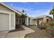 Attractive home facade with a well-kept lawn, desert landscaping, and a welcoming front entrance at 11430 N 109Th St, Scottsdale, AZ 85259