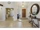Open foyer showcasing tile flooring, neutral paint, and views into the office and living spaces at 11430 N 109Th St, Scottsdale, AZ 85259