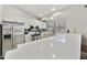 Bright kitchen features white cabinets, stainless steel appliances, and stone countertops at 11430 N 109Th St, Scottsdale, AZ 85259