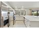 This kitchen features stainless appliances, white cabinetry and stone countertops at 11430 N 109Th St, Scottsdale, AZ 85259