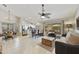 Open concept living room with bar seating, dining area, and sliding doors to the pool at 11430 N 109Th St, Scottsdale, AZ 85259