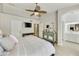 Main bedroom featuring a ceiling fan, an ensuite bath and plenty of closet space at 11430 N 109Th St, Scottsdale, AZ 85259