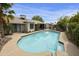 Inviting backyard pool with a lounge area, surrounded by lush landscaping, perfect for relaxing and entertaining outdoors at 11430 N 109Th St, Scottsdale, AZ 85259
