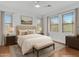 Bright bedroom with large windows, neutral decor and stylish furnishings at 11500 E Cochise Dr # 2001, Scottsdale, AZ 85259