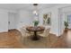 Dining area with a round table, seating for four, and modern chandelier at 11500 E Cochise Dr # 2001, Scottsdale, AZ 85259
