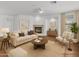 Bright living room with fireplace, neutral decor and a ceiling fan at 11500 E Cochise Dr # 2001, Scottsdale, AZ 85259