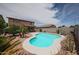 Relaxing backyard with sparkling pool and desert landscaping at 11563 W Jefferson St, Avondale, AZ 85323