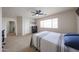 Large bedroom with window, ceiling fan, and ensuite bathroom at 11563 W Jefferson St, Avondale, AZ 85323