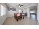 Inviting dining area featuring a large table, ceiling fan, and neutral colors, great for Gathering meals at 11563 W Jefferson St, Avondale, AZ 85323