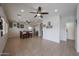View of the dining room, with tile flooring and large ceiling fan at 11563 W Jefferson St, Avondale, AZ 85323