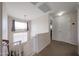Hallway filled with natural light and a view of the stairs at 11563 W Jefferson St, Avondale, AZ 85323