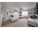 Living room with a plush sectional sofa and neutral carpeting at 11563 W Jefferson St, Avondale, AZ 85323