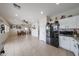Open concept living room with access to the kitchen and dining area at 11563 W Jefferson St, Avondale, AZ 85323