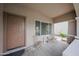 Welcoming front porch featuring neutral tones, seating and a place to enjoy the outdoors at 11563 W Jefferson St, Avondale, AZ 85323