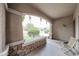 Inviting covered porch with stone accents, offering a relaxing outdoor space to enjoy the neighborhood views at 11563 W Jefferson St, Avondale, AZ 85323