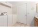 Bright bathroom featuring a sink, a bathtub, and neutral wall-to-wall tiling at 11622 W Buck Mountain Ct, Surprise, AZ 85378