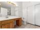 Bathroom with a vanity, a large mirror, a toilet and a closet with sliding doors at 11622 W Buck Mountain Ct, Surprise, AZ 85378