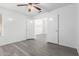 Bright, airy bedroom with new ceiling fan and modern vinyl plank flooring at 11622 W Buck Mountain Ct, Surprise, AZ 85378