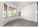 Bright dining area featuring modern light fixture and large windows at 11622 W Buck Mountain Ct, Surprise, AZ 85378