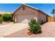 Single story home with a two-car garage and desert landscaping at 11622 W Buck Mountain Ct, Surprise, AZ 85378