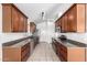 Modern kitchen with stainless steel appliances and dark granite countertops at 11622 W Buck Mountain Ct, Surprise, AZ 85378