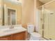 Bathroom with a stand up shower with glass doors and a single sink vanity at 12325 W Canterbury Dr, El Mirage, AZ 85335