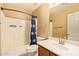 This bathroom has a shower and bath combination, a toilet, and a single sink at 12325 W Canterbury Dr, El Mirage, AZ 85335
