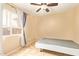 Bedroom with a ceiling fan, tile floors, and a window with horizontal blinds at 12325 W Canterbury Dr, El Mirage, AZ 85335