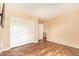 Bedroom with vinyl floors, closet, and exterior views at 12325 W Canterbury Dr, El Mirage, AZ 85335