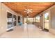 Large covered patio with a ceiling fan and views of the backyard at 12325 W Canterbury Dr, El Mirage, AZ 85335