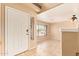 Foyer features tile floors, neutral walls, and a view into the front living room at 12325 W Canterbury Dr, El Mirage, AZ 85335