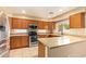 A closer view of the kitchen featuring granite countertops and stainless steel double oven and microwave at 12325 W Canterbury Dr, El Mirage, AZ 85335