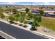 Aerial view showcases a neighborhood park and playground with open space, trees, and recreation areas for residents at 12516 W Mclellan Ct, Glendale, AZ 85307