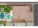 Bird's-eye view showcases a home with a backyard pool, patio, and well-maintained landscaping at 12516 W Mclellan Ct, Glendale, AZ 85307