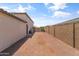 The backyard features a dirt yard space. Great blank canvas to create your dream yard at 12516 W Mclellan Ct, Glendale, AZ 85307