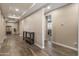 Spacious hallway features tile flooring, neutral walls, and recessed lighting at 12516 W Mclellan Ct, Glendale, AZ 85307