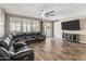 Cozy living room featuring recessed lighting, and a sizable dark colored leather couch at 12516 W Mclellan Ct, Glendale, AZ 85307