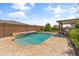 Beautiful backyard pool with water feature, steps, and travertine tile at 12516 W Mclellan Ct, Glendale, AZ 85307