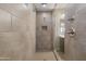 Contemporary walk-in shower featuring neutral tile and chrome fixtures at 12516 W Mclellan Ct, Glendale, AZ 85307